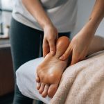 Experience ultimate relaxation with a soothing foot massage in a calming indoor environment.